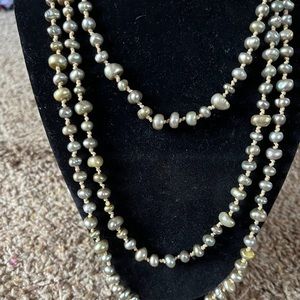Greenish colored pearl necklace